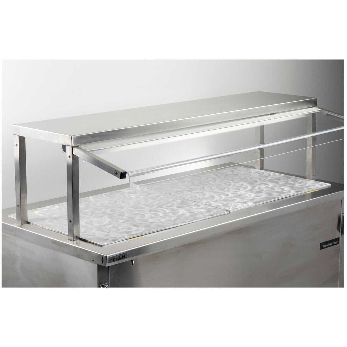 A commercial food service counter with a stainless steel and aluminum build, featuring a sneeze guard and an empty chilled top surface. Designed for use with cold food templates in cafeterias or buffets, the unit is clean, unused, and easy to maintain.