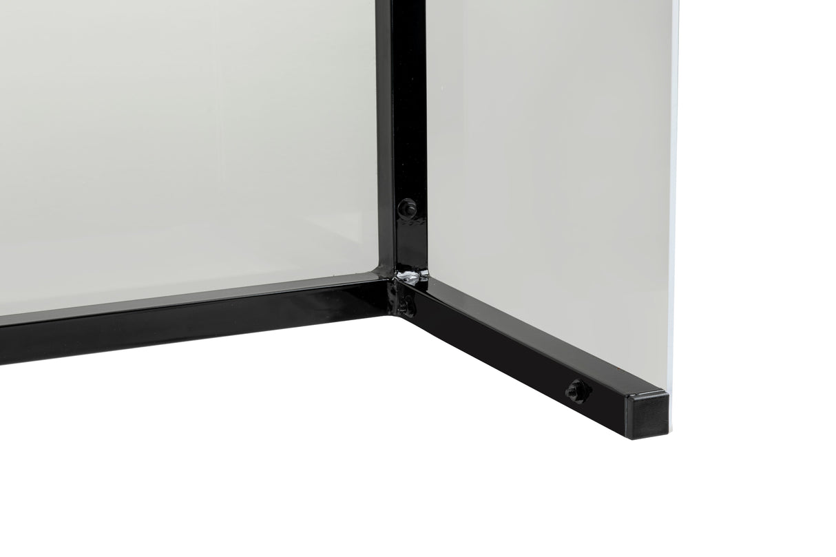 Close-up of the corner of a Freestanding Acrylic Shield with a black metal frame. The right-angle frame, from TableCraft Products, features visible screws securing the transparent panels. The background is plain and white.