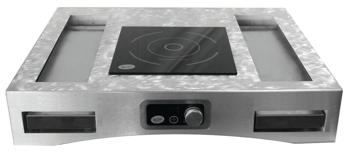 A modern, industrial Induction Countertop Station Kit featuring a smooth black electric induction cooktop at the center, cast aluminum trays on either side, and a control knob with digital display on the front stainless steel panel.