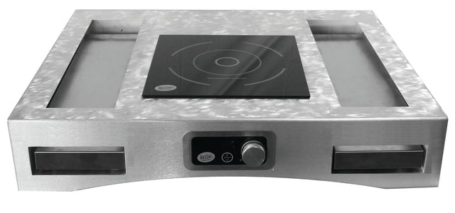 A modern, industrial Induction Countertop Station Kit featuring a smooth black electric induction cooktop at the center, cast aluminum trays on either side, and a control knob with digital display on the front stainless steel panel.