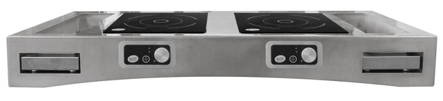A stainless steel Double Induction Countertop Station is seen from the front, featuring two black induction cooktops with circular patterns, control panels with dials and buttons, and pull-out drawers or trays on either side against a plain white background.