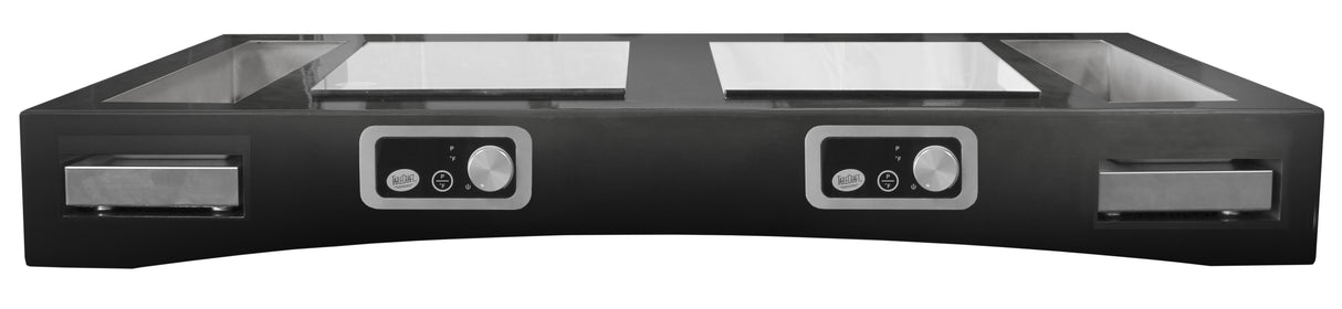 The TableCraft Products Double Induction Countertop Station features two heating zones, each with a control knob and digital display. This sleek black cooktop with metallic accents also includes pull-out trays for added convenience.