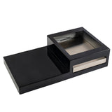 A glossy black rectangular Action Station box with a raised square compartment featuring a metal interior. A horizontal metallic accent highlights the single burner design, creating a modern and minimalistic look against a white background.