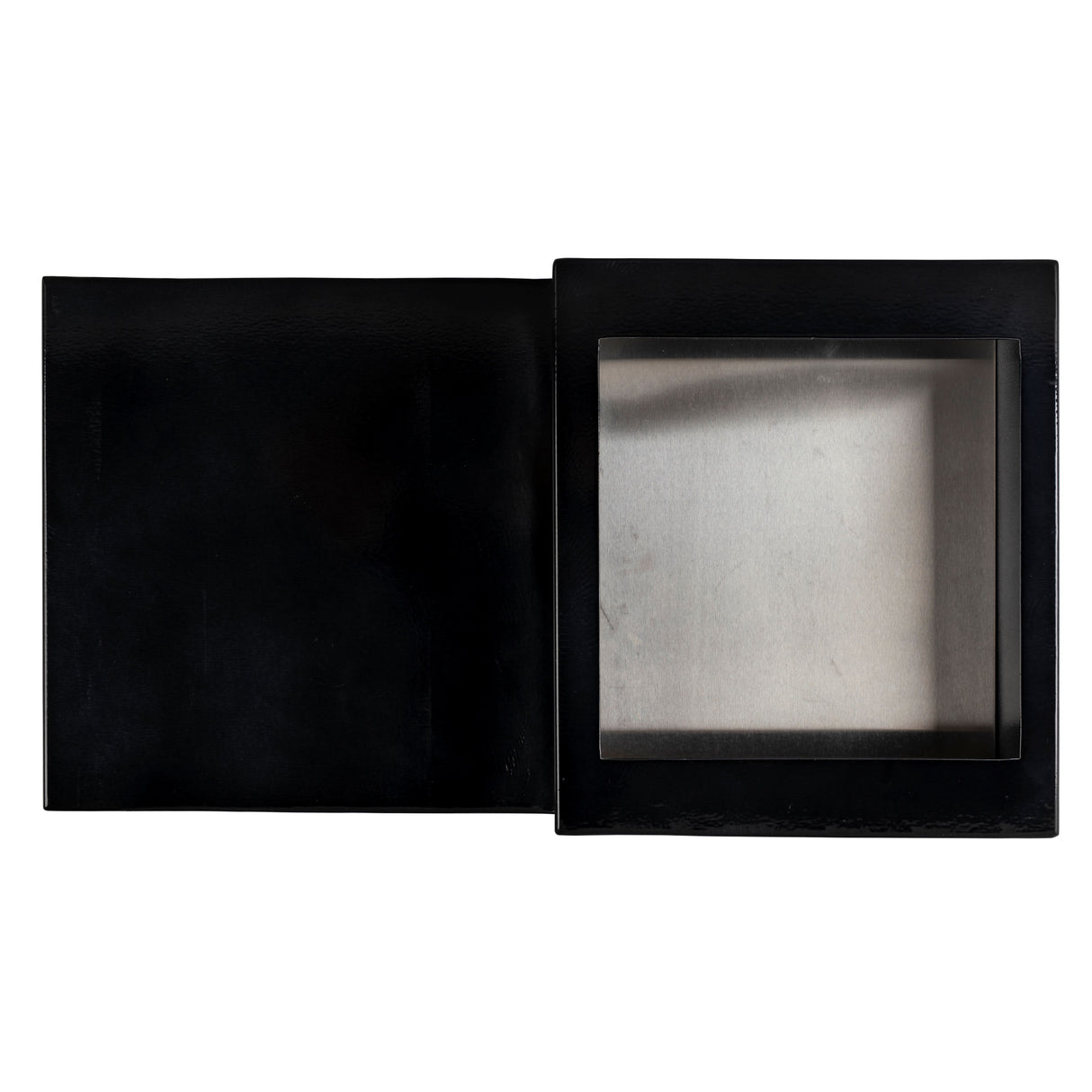 A black rectangular box with a hinged lid, shown open. The right side features a transparent window revealing a metallic butane single burner interior, while the left side is solid black. The background is plain white.