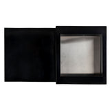 A black rectangular box with a hinged lid, shown open. The right side features a transparent window revealing a metallic butane single burner interior, while the left side is solid black. The background is plain white.