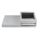 A brushed metal rectangular Action Station with two sections: a solid left segment and a right segment featuring a square open tray above a shallow drawer. The modern, minimalist design showcases clean lines and a metallic finish.