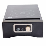 A black TableCraft Products Induction Station cooktop with a single burner marked by white lines. The front panel features a round control knob and power indicator with IdealChef branding, showcasing a modern, minimalistic design.