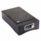 A modern black Induction Station cooktop with a single burner and a circular cooking zone. It features a digital display control panel and a round silver knob on the front, set against a slightly raised, rectangular base.