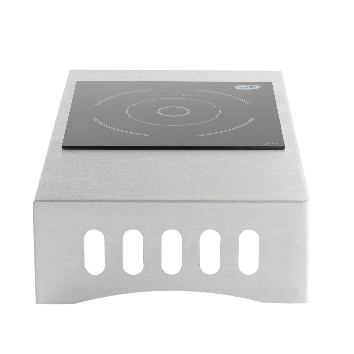 The Induction Station by TableCraft Products is a single burner cooktop with a stainless steel body, flat black glass surface featuring white concentric circles, and a rounded front with vertical ventilation slits for a sleek finish.
