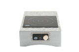 The TableCraft Products Induction Station features a stainless steel countertop single burner with a sleek black glass surface, circular burner design, and intuitive front panel with knob, digital display, and labeled power and temperature controls.