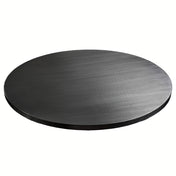 A smooth, flat, round, black metal disc lies on a white background. With its slight reflective sheen and subtle texture, this TableCraft aluminum table cover has fine lines and a thin profile, showcasing a sleek and simple circular shape.