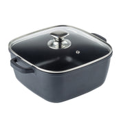 A square black die-cast aluminum cooking pot with two side handles and a clear glass lid featuring a metal handle and small steam vent, perfect as an induction sauce pan. Shown against a plain white background.