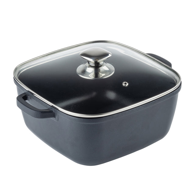 A square black die-cast aluminum cooking pot with two side handles and a clear glass lid featuring a metal handle and small steam vent, perfect as an induction sauce pan. Shown against a plain white background.