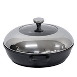 A shiny, reflective stainless steel casserole dish with a matching domed lid and large round knob handle. The pot features a matte black base made from die-cast aluminum, two small side handles, and a surface that reflects its surroundings.