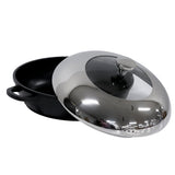 A black die-cast aluminum round casserole dish with side handles and a shiny stainless steel lid, partially open to reveal a glass window and knob handle on top; the non-stick pot sits on a white surface.
