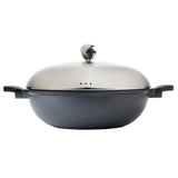 A black, round die-cast aluminum Casserole Dish with two short handles and a matte finish, shown with a shiny silver metal lid featuring a rounded knob on top. The lid has small holes for ventilation. Set against a plain white background.