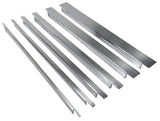 Six long, stainless steel bars of varying widths and lengths are arranged in a row on a white background. Each bar in this TableCraft spacer bar kit has a smooth, slightly reflective surface with distinct grooves or notches on the ends.