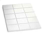 A white, rectangular object resembling a chocolate bar with 15 raised, square segments is shown on a white background. Made from Duracoat coated cast aluminum, it features a smooth surface and is dishwasher safe.