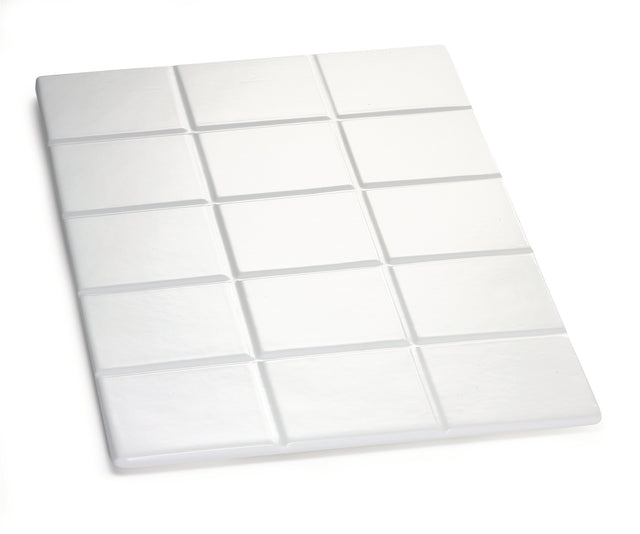 A white, rectangular object resembling a chocolate bar with 15 raised, square segments is shown on a white background. Made from Duracoat coated cast aluminum, it features a smooth surface and is dishwasher safe.