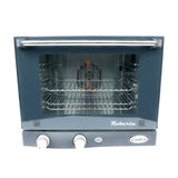 Front view of a compact quarter size countertop convection oven with a glass door, two control knobs, a power indicator light, and two wire racks inside. The Roberta and Cadco brand names are visible on the gray exterior below the door.