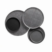 Three round trays are arranged overlapping on a white background. Two trays, crafted from fiberglass, have a subtle crisscross texture, while two smaller, smooth Serving Camtrays—dishwasher safe—are nested inside the larger trays.