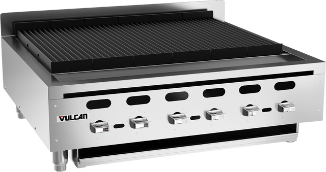 A commercial stainless steel Vulcan charbroiler with four control knobs, sturdy grill grates, a raised back guard, ventilation slots, and short legs for countertop use. This industrial countertop charbroiler is designed for professional kitchen settings.