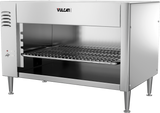 A stainless steel Vulcan cheesemelter broiler with open front, metal grate, adjustable rack grooves on the left, four sturdy legs, countertop installation design, and small control knobs; features the brand name Vulcan on the upper front panel.