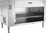 A commercial stainless steel salamander broiler with the brand name Vulcan on the top right. Featuring quartz infrared heating, it has an open front, a grilling rack inside, vent slits on the side, a control knob, power switch, and stands on four metal legs.