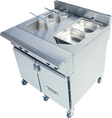 A commercial stainless steel fryer station with two wire baskets, food trays, and storage cabinets below on caster wheels. The unit features durable stainless steel construction, a flat work surface, and the Vulcan brand name clearly visible on the front.