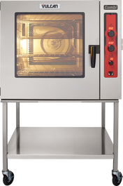 A stainless steel boilerless Combi oven steamer with a lit interior, labeled Vulcan and Combi. It features a clear glass door, black handle, red control panel, and is mounted on a metal stand with a lower shelf and wheels.