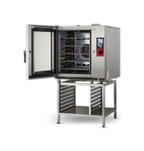 A commercial Vulcan TCM-102E combi oven with its door open reveals multiple wire racks inside. The oven sits on a matching metal stand with a lower shelf and side rails, while a digital control panel is visible on the front right.