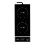 A black, rectangular induction cooktop with a double hob labeled HELIOS. Below the burners are digital controls, buttons, and a single knob. A power cord extends from the top. The overall design is modern, minimalistic, and easy to use.