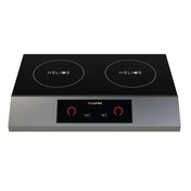 A sleek, modern double induction cooktop with a black glass surface and silver base. This portable design double hob features two “HELIOS” burners on top and a digital control panel with red dials and touch buttons in the front center.