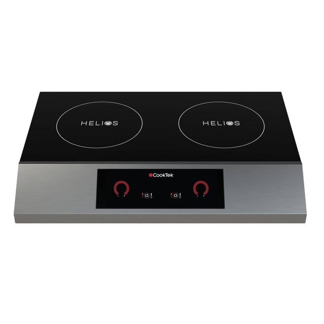 A sleek, modern double induction cooktop with a black glass surface and silver base. This portable design double hob features two “HELIOS” burners on top and a digital control panel with red dials and touch buttons in the front center.
