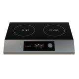 A double hob induction cooktop with a sleek black glass surface labeled HELIOS on each burner, stainless steel trim, digital display, control buttons, and a central rotary knob in a portable design.