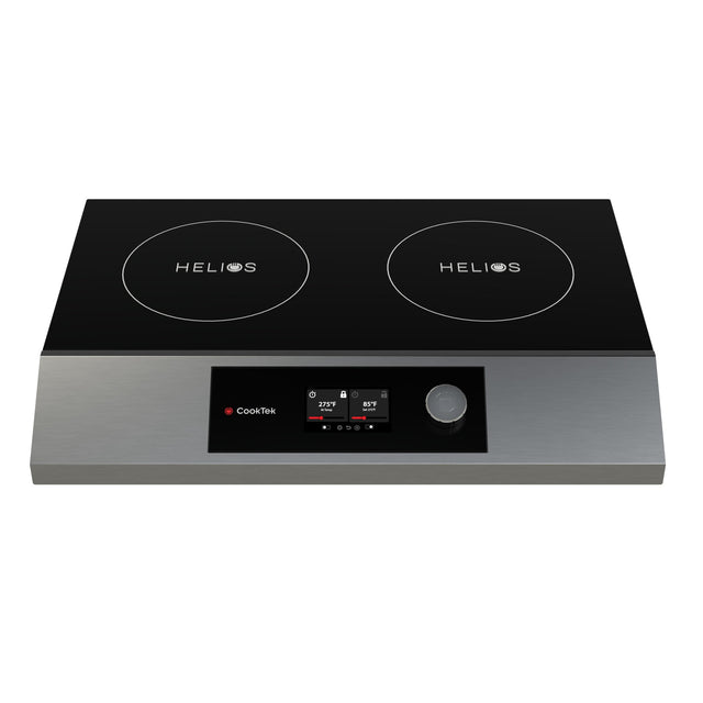 A double hob induction cooktop with a sleek black glass surface labeled HELIOS on each burner, stainless steel trim, digital display, control buttons, and a central rotary knob in a portable design.