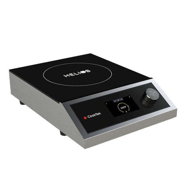 A modern portable induction cooktop with a sleek black glass surface, digital display, single control knob, and CookTek branding. The countertop appliance features a white circle with “HELIOS” text at the center, metal sides, and four small feet.