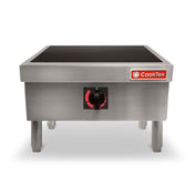A stainless steel CookTek Induction Range cooktop with four sturdy legs, a black glass surface, a central control knob, and a red CookTek logo on the front panel. The unit is photographed against a white background.