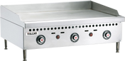 A 36 inch stainless steel countertop gas griddle with a polished steel griddle plate, three control knobs, indicator lights, and ventilation holes. The flat surface features raised back and side splash guards, four sturdy legs, and the Vulcan brand name.