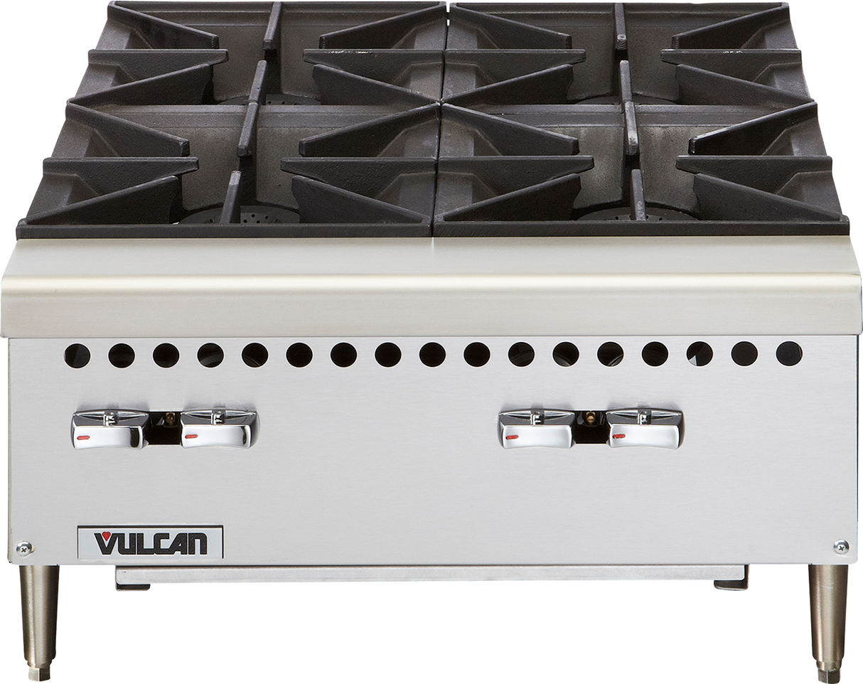 A stainless steel commercial gas hotplate stove with four large black cast iron burners, sturdy control knobs at the front, ventilation holes above the knobs, and the Vulcan brand logo in the lower left corner. The stove stands on four metal legs.