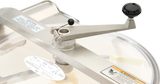 A close-up of a stainless steel manual crank handle with a black knob, attached to the lid of a Hobart Cutter Mixer. Warning and caution labels, plus a diagram sticker, are visible on the metal surfaces and 45 qt capacity stainless steel bowl.