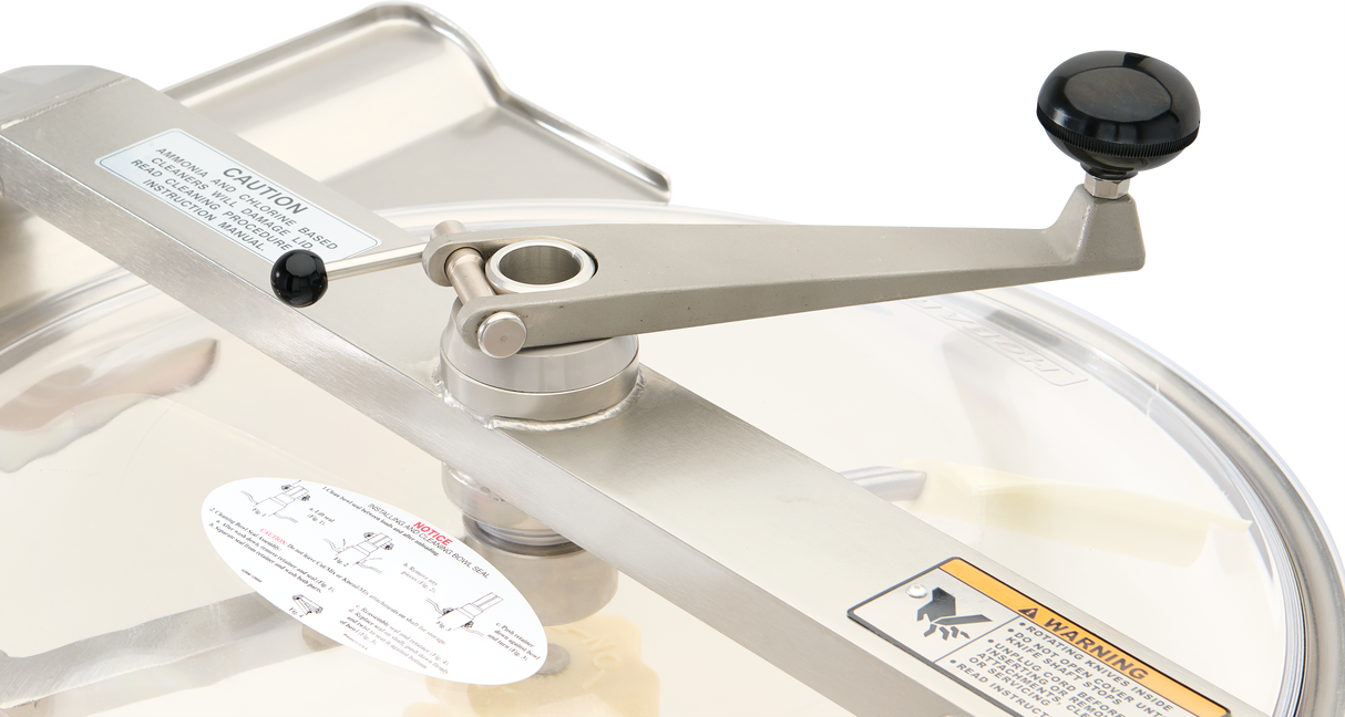 A close-up of a Hobart Cutter Mixer shows its manual crank handle with a black knob, attached to the transparent lid above the stainless steel bowl. Caution labels and an instructional diagram are visible, highlighting its 45 qt capacity.