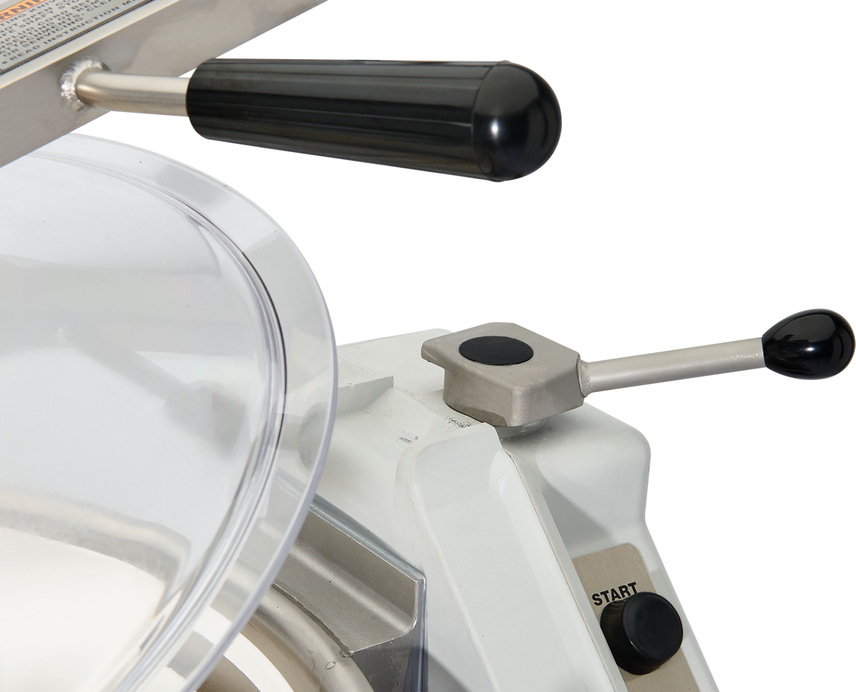 Close-up of a Hobart Cutter Mixer food slicer showing a black-handled lever and a metal lever with a black knob. A clear plastic safety guard covers the blade area, and a rectangular “START” button is visible on the white base.