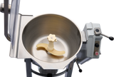 A top view of a Hobart Cutter Mixer shows a stainless steel bowl with a cream-colored plastic blade inside. The machine features a control panel with heat and stop buttons, two metal levers, and is set against a plain white background.