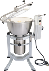 A large, industrial Hobart HCM450 Cutter Mixer with a stainless steel bowl, attached control panel with buttons, transparent hinged lid, and thick power cord. The mixer stands on a sturdy metal frame with angled legs and includes a mix attachment.