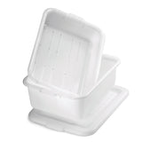 A white plastic rectangular storage bin, made from high density polyethylene and dishwasher safe, is shown with its matching lid placed underneath. The bin is partially tilted and nested inside another identical container against a plain white background.