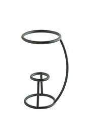 A minimalist black powder coated metal cone holder by TableCraft, featuring two circular rings connected by vertical and curved rods; the larger ring at the top sits above a smaller ring near the base, creating an open geometric structure.