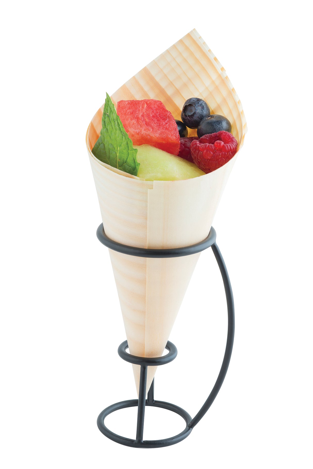 A decorative wooden cone filled with assorted fresh fruits—watermelon, honeydew melon, raspberries, blueberries, and a mint leaf—stands upright in a TableCraft black powder coated metal cone holder against a white background.