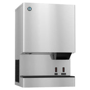 A stainless steel commercial ice maker and water dispenser with two push buttons labeled ICE and WATER beneath a black dispensing chute. The unit produces cubelet ice, has a logo in the top left corner, and an air vent on the lower left side.
