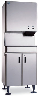 A tall, stainless steel Hoshizaki DCM-500BWH with a boxy top dispenser, control buttons, and a lower cabinet on four black legs. This Opti-Serve Ice Maker features a logo on the top left and black handles on the cabinet doors below.